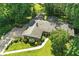 Charming home with a well-manicured lawn and mature trees at 7736 Wawasee Dr, Indianapolis, IN 46250