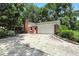 View of brick house and large driveway at 7736 Wawasee Dr, Indianapolis, IN 46250