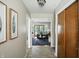 Hallway leading to the living room, features a patterned rug at 7736 Wawasee Dr, Indianapolis, IN 46250