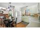 Bright kitchen with white cabinets, stainless appliances, and an eat-in dining area at 7736 Wawasee Dr, Indianapolis, IN 46250