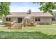 A cozy home exterior featuring a deck, sliding door, and outdoor seating, perfect for backyard relaxation at 792 Nevelle Ln, Carmel, IN 46032