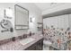 Bathroom featuring a floral shower curtain and black countertop at 792 Nevelle Ln, Carmel, IN 46032