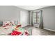 Cozy bedroom with a mushroom-themed bedspread, white closet doors, and a window at 792 Nevelle Ln, Carmel, IN 46032
