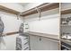 Walk-in closet with shelving units and hanging racks to maximize storage for clothes and shoes at 792 Nevelle Ln, Carmel, IN 46032