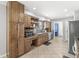 Charming kitchen showcasing wood cabinets, stainless steel dishwasher, and ample counter space at 792 Nevelle Ln, Carmel, IN 46032
