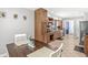Spacious kitchen showcasing wooden cabinets and a dark-stained dining table with white chairs at 792 Nevelle Ln, Carmel, IN 46032