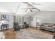 Bright living room features hardwood floors, vaulted ceilings, and plenty of space for seating at 792 Nevelle Ln, Carmel, IN 46032