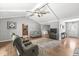 Open-concept living room boasts hardwood floors, vaulted ceilings, and easy access to the kitchen and dining areas at 792 Nevelle Ln, Carmel, IN 46032