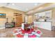Basement kitchenette with white cabinets, a dining table, and tile flooring at 817 Hickory Way, Noblesville, IN 46062