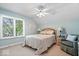 Bright bedroom with a large window, ceiling fan, and neutral decor at 817 Hickory Way, Noblesville, IN 46062
