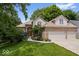 Charming brick home with a well-manicured lawn and lush landscaping at 817 Hickory Way, Noblesville, IN 46062