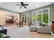 Bright living room with a step-down eating area and scenic views of the backyard at 817 Hickory Way, Noblesville, IN 46062
