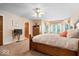 Cozy main bedroom featuring a king-size bed, bay window, and ample natural light at 817 Hickory Way, Noblesville, IN 46062