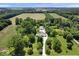 Expansive aerial view showcases the property's layout, landscaping, and surrounding acreage at 881 W 1050 N, Fortville, IN 46040