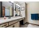 Bathroom featuring a large countertop, white cabinetry, and a double-mirrored vanity at 881 W 1050 N, Fortville, IN 46040
