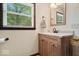Bathroom featuring granite countertop, wood cabinets, and natural light from the open window at 881 W 1050 N, Fortville, IN 46040