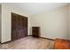 Bright bedroom with hardwood floors and closet with folding doors at 881 W 1050 N, Fortville, IN 46040