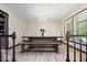 Charming dining room with a rustic dining table, chandelier, and large windows at 881 W 1050 N, Fortville, IN 46040