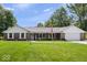 Charming brick home with manicured lawn and a welcoming front porch at 881 W 1050 N, Fortville, IN 46040