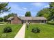 Well-maintained ranch home with a brick exterior, manicured lawn, and mature trees at 881 W 1050 N, Fortville, IN 46040