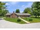 Beautiful brick ranch-style house with well-kept lawn and landscaping at 881 W 1050 N, Fortville, IN 46040