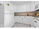 Clean kitchen featuring white cabinetry, modern appliances, and neutral countertops at 881 W 1050 N, Fortville, IN 46040
