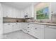Bright kitchen with white cabinets, modern appliances, and plenty of counter space at 881 W 1050 N, Fortville, IN 46040