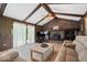 Relaxing living room with a vaulted ceiling, brick fireplace, and comfortable sectional sofa at 881 W 1050 N, Fortville, IN 46040