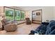 Bright living room featuring large windows and comfortable seating arrangements at 881 W 1050 N, Fortville, IN 46040