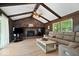 Cozy living room with wood paneling, brick fireplace, and comfortable seating at 881 W 1050 N, Fortville, IN 46040