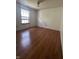 Bright bedroom with wood-look laminate flooring and natural light at 8849 Summer Walk E Dr, Indianapolis, IN 46227