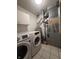 Functional laundry room features modern washer and dryer at 8849 Summer Walk E Dr, Indianapolis, IN 46227