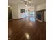 Open living room with a brick fireplace and a ceiling fan at 8849 Summer Walk E Dr, Indianapolis, IN 46227