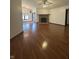 Spacious living room with beautiful wood floors and a cozy brick fireplace at 8849 Summer Walk E Dr, Indianapolis, IN 46227