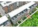 Overhead view highlighting roof top patios with outdoor seating and tree filled courtyard at 906 Berkhamsted Ln, Carmel, IN 46032