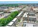 Aerial view of townhomes and urban development with lush landscaping at 906 Berkhamsted Ln, Carmel, IN 46032