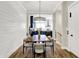 Charming dining area featuring shiplap walls and seamless transition to kitchen at 906 Berkhamsted Ln, Carmel, IN 46032