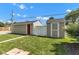 Large backyard featuring two sheds and mature trees at 917 W Busby St, Lebanon, IN 46052