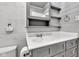 Bathroom with single vanity and sink, with medicine cabinet and toilet at 917 W Busby St, Lebanon, IN 46052