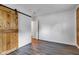 Bedroom with wood accent wall and a barn door entry to closet for a rustic feel at 917 W Busby St, Lebanon, IN 46052
