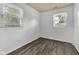Bright bedroom featuring modern flooring and natural light from two windows at 917 W Busby St, Lebanon, IN 46052