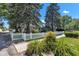Quaint home with a white picket fence, mature trees, and well-maintained landscaping at 917 W Busby St, Lebanon, IN 46052