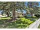 Charming home with mature trees, a well-manicured lawn, and white picket fence at 917 W Busby St, Lebanon, IN 46052