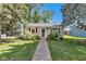 A charming home with a brick walkway leading to the front door, and an American flag at 917 W Busby St, Lebanon, IN 46052