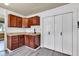 Traditional kitchen features wood cabinetry, granite counters, white backsplash, and stainless steel appliances at 917 W Busby St, Lebanon, IN 46052