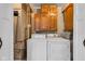 Laundry room with wood cabinets and newer washer and dryer at 917 W Busby St, Lebanon, IN 46052
