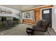 Cozy living room featuring hardwood floors, rustic wood-paneled wall, and bright window views at 917 W Busby St, Lebanon, IN 46052