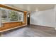 Cozy living room boasting wood paneling, wainscoting, and natural light from the window at 917 W Busby St, Lebanon, IN 46052