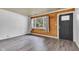 Bright living room featuring wood paneling, wainscoting, and durable flooring at 917 W Busby St, Lebanon, IN 46052
