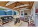 Inviting outdoor patio with wood ceiling, comfortable seating, and a cozy grill at 917 W Busby St, Lebanon, IN 46052